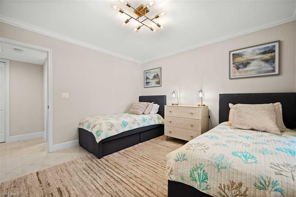 Neutral wall color with crown molding and baseboards