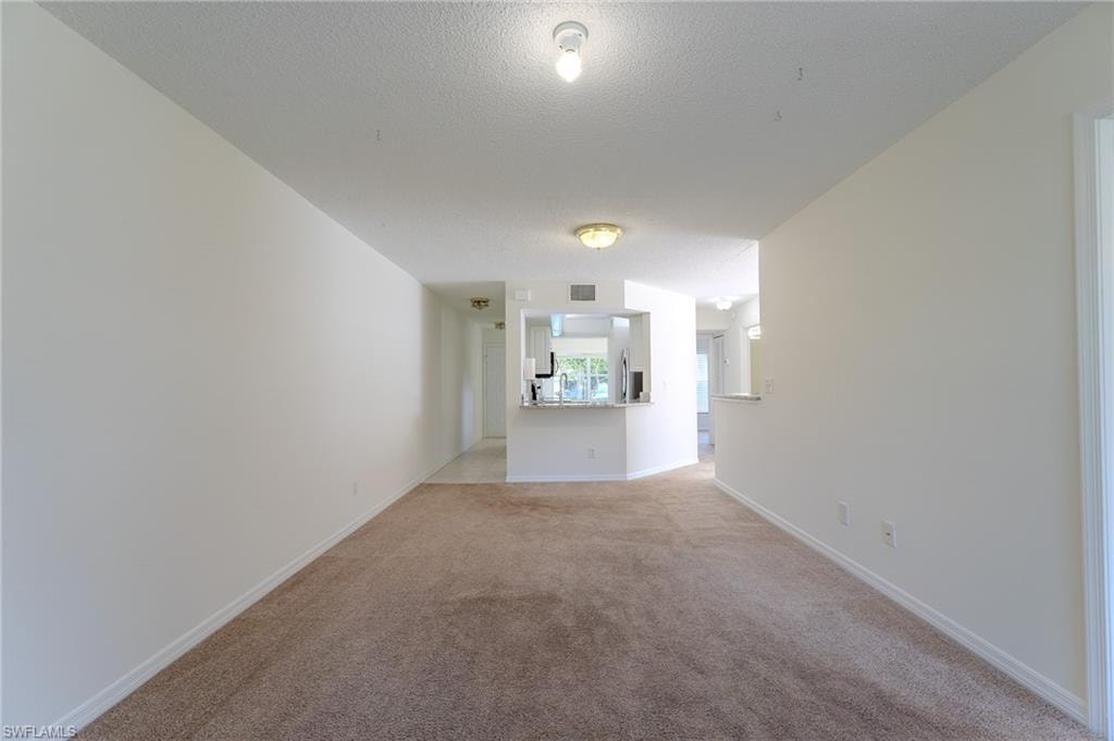 Living room to front view of unit