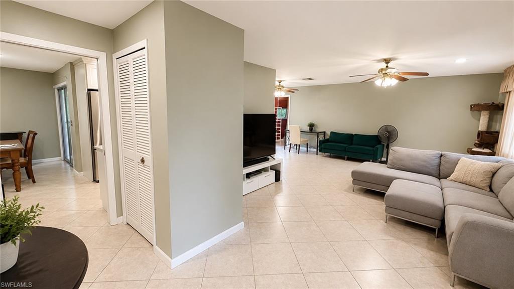 Spacious interior featuring neutral wall tones and tile flooring throughout