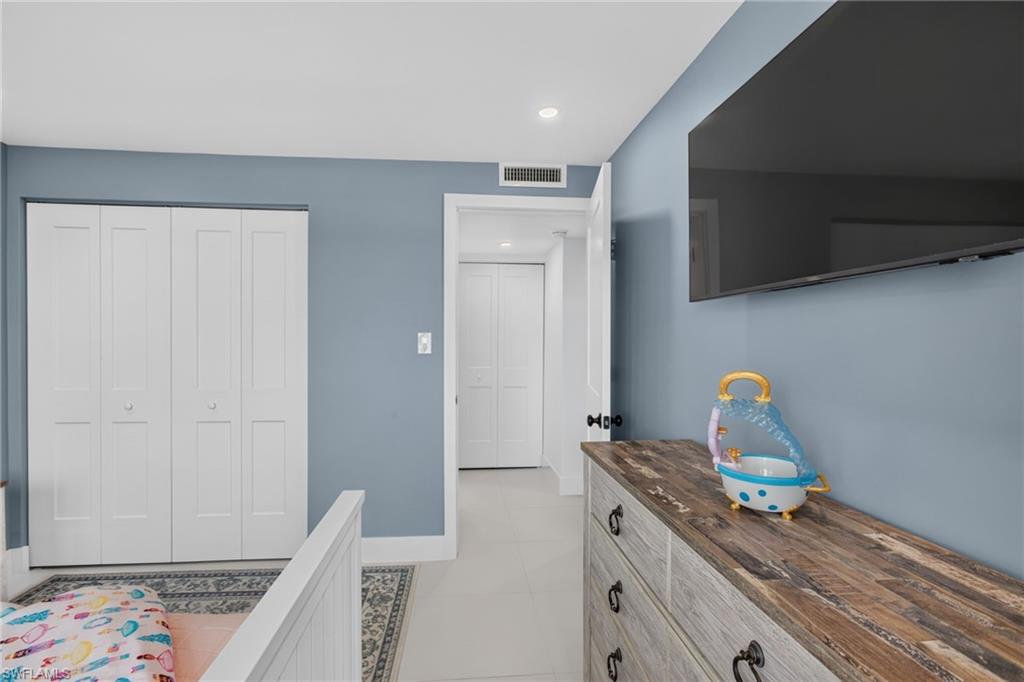 Guest bedroom also have custom closet system.