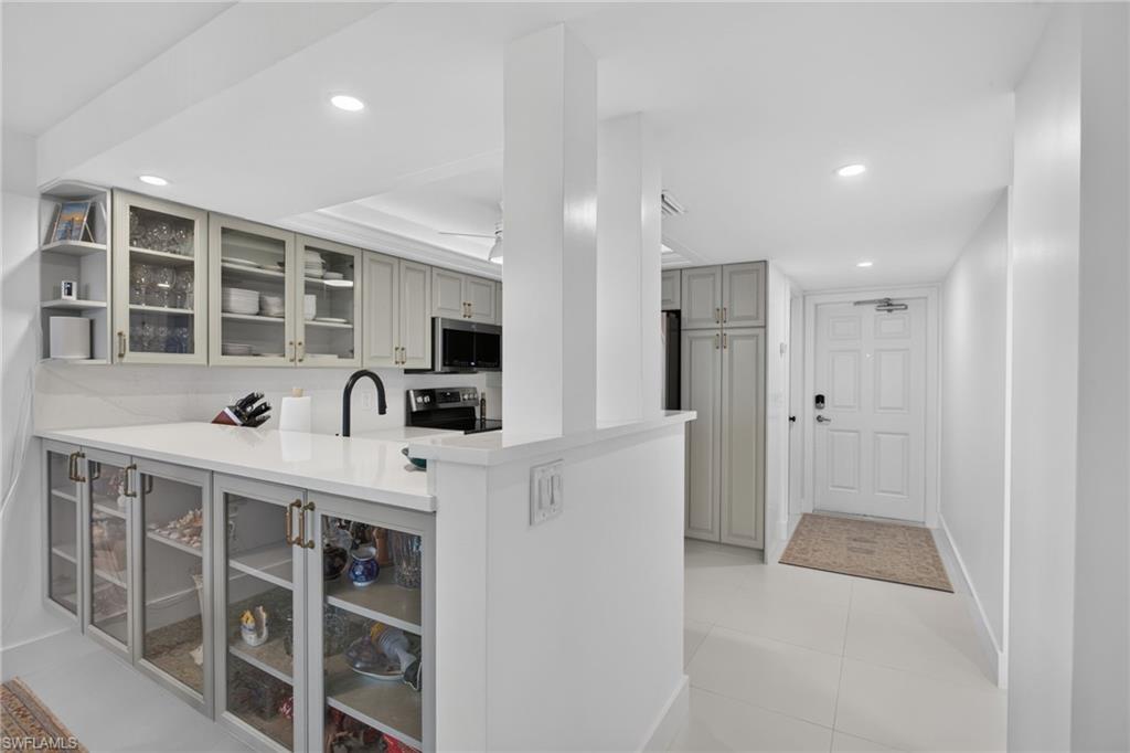 Exquisite Remodel. Additional glass cabinetry under the counter.