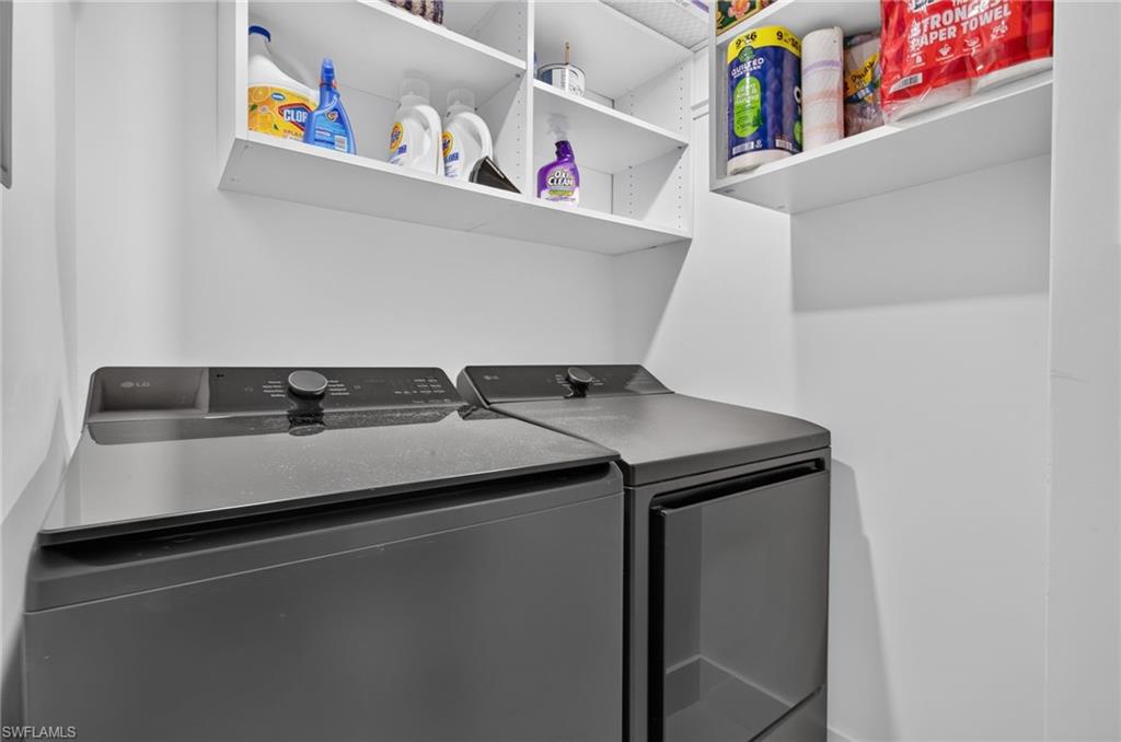 New full size LG washer and dryer in separate laundry room.