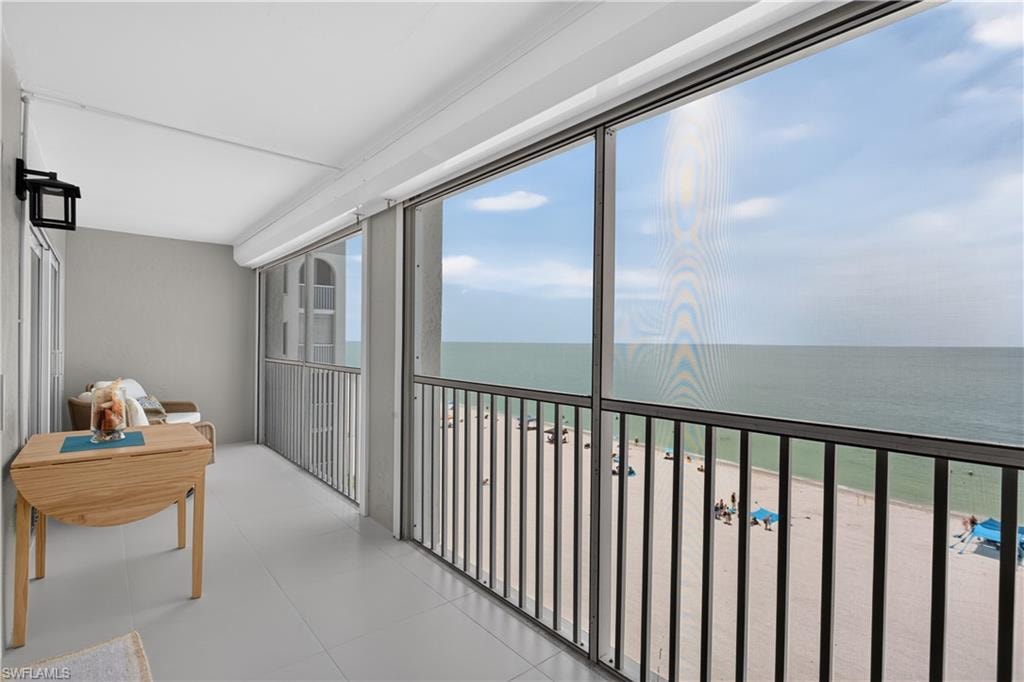 Spacious tiled balcony with new electric storm shutters.