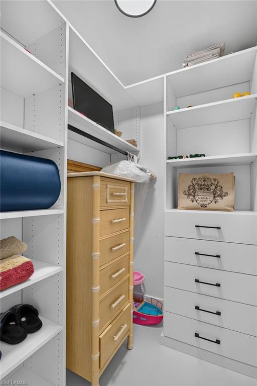 There are 2 closets in Primary Bedroom, each with custom cabinetry.
