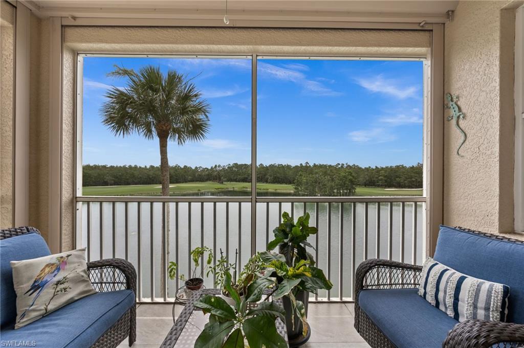 Screened balcony offering expansive golf course and water body scenery