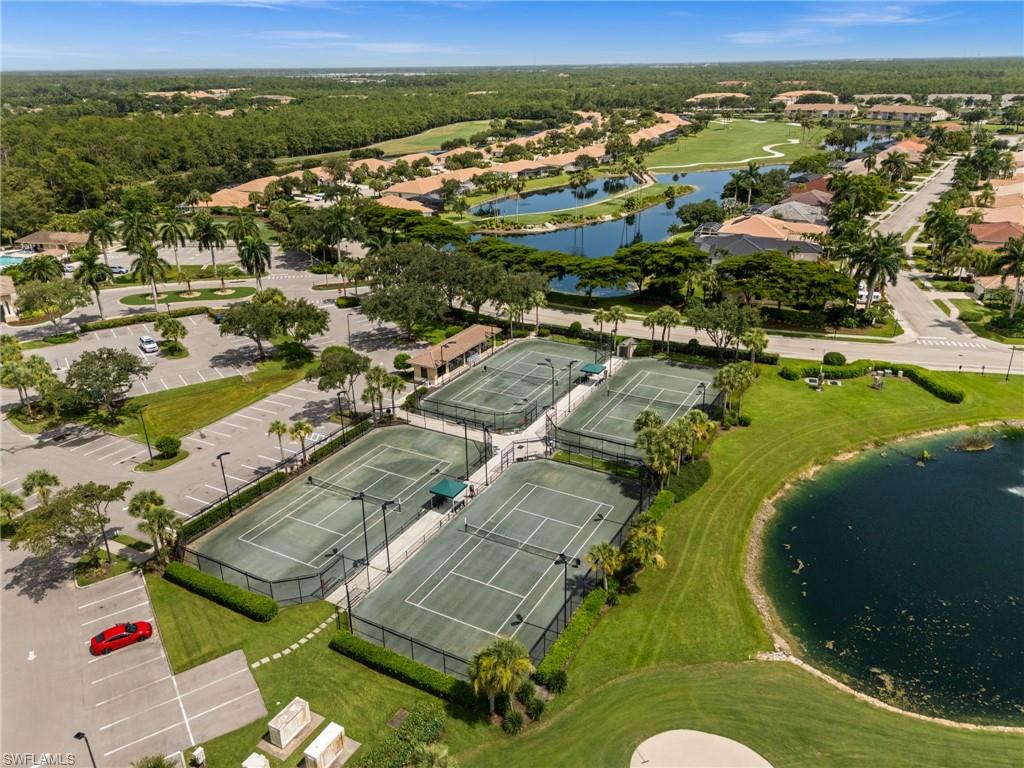 Community tennis courts featuring four distinct playing surfaces with surrounding fencing