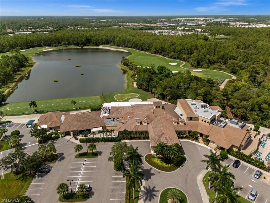 Aerial perspective showcasing a clubhouse structure with a multi-gabled tile roof