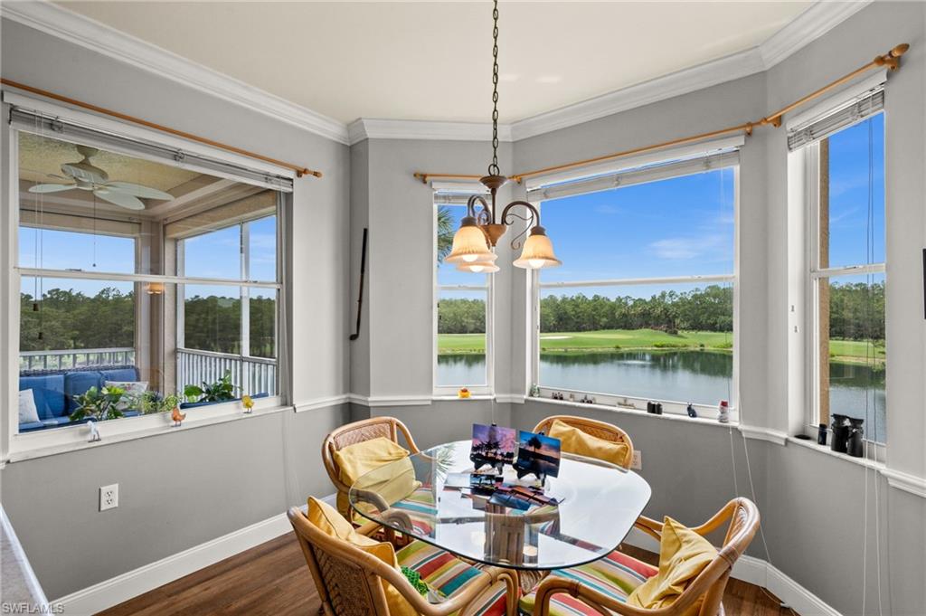 Bay window dining area with expansive water and golf course scenery