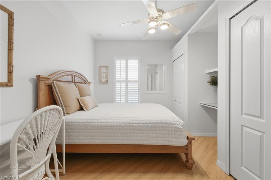 The versatile second bedroom offers beautiful plantation shutters, an abundance of natural light, and two closets for ample storage. Designed for flexibility, this inviting space can also serve as a private home office or dedicated workspace to suit your lifestyle needs.