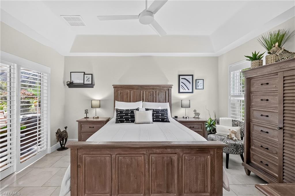 Primary Bedroom with Sliding glass doors to the pool area.