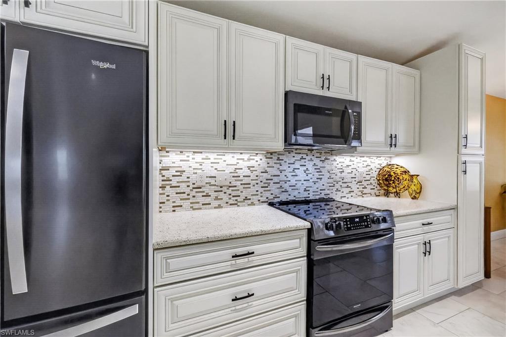 Newer cabinetry, quartz countertop and appliances