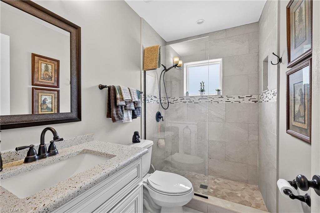 Guest Bathroom with tile shower and quartz countertop.