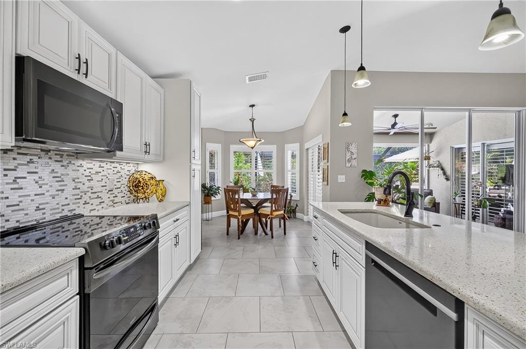 Open kitchen area with countertop island.