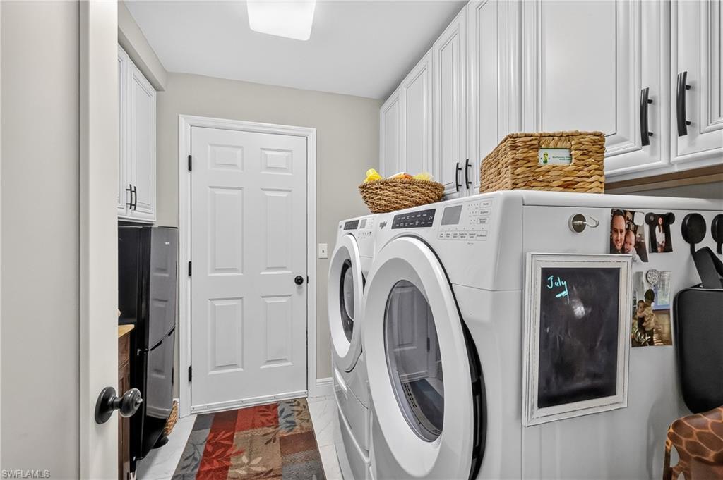 Laundry Room with washer, dryer, and laundry tub.