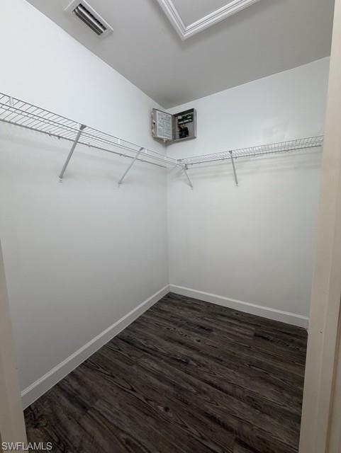 Interior space featuring wood-finish flooring, white baseboards, and white walls