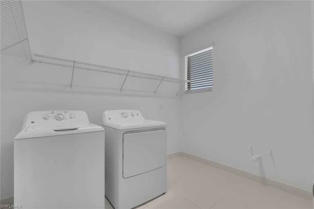 Spacious laundry room pre-plumbed for a utility sink.