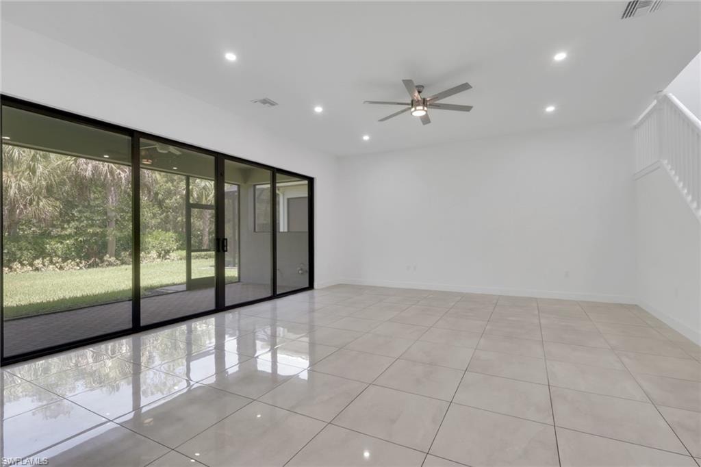 Living room has large sliding doors for ample natural daylight.
