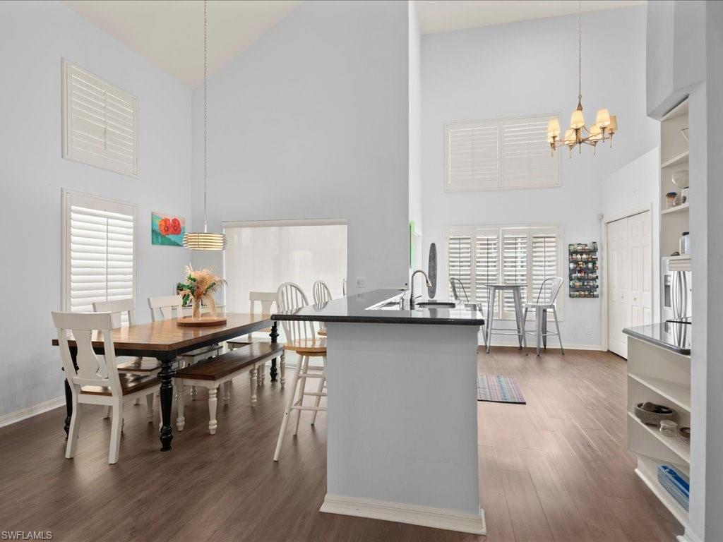 Dining and kitchen with vaulted ceilings