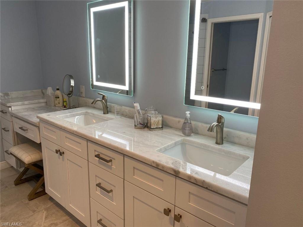 Bathroom featuring double vanity