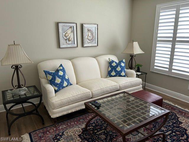 Living room with wood finished floors and baseboards