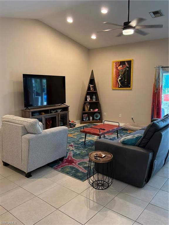 Living area with high vaulted ceilings, recessed lighting, and a ceiling fan