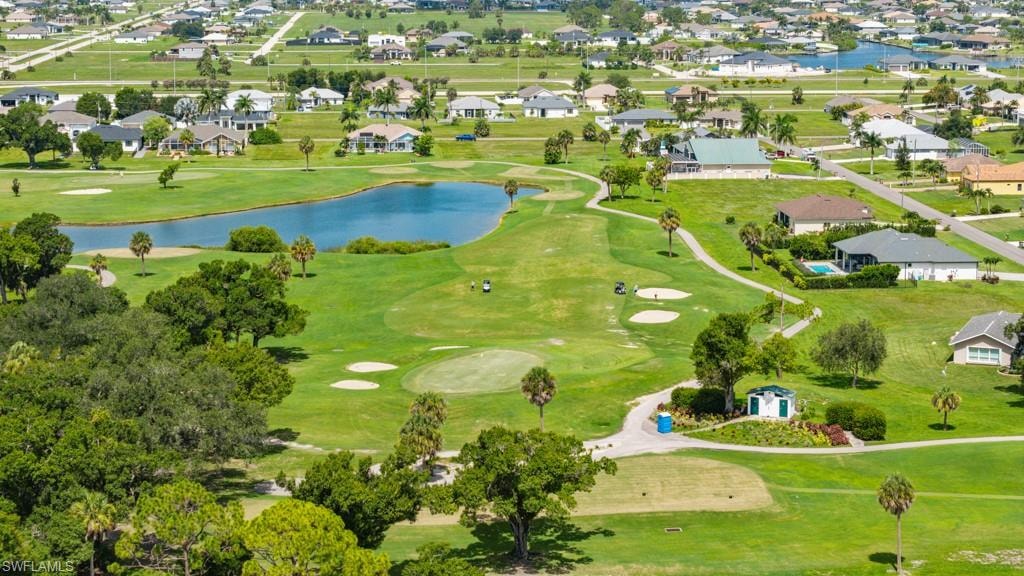Golf course setting with manicured greens, sand traps, and a water feature