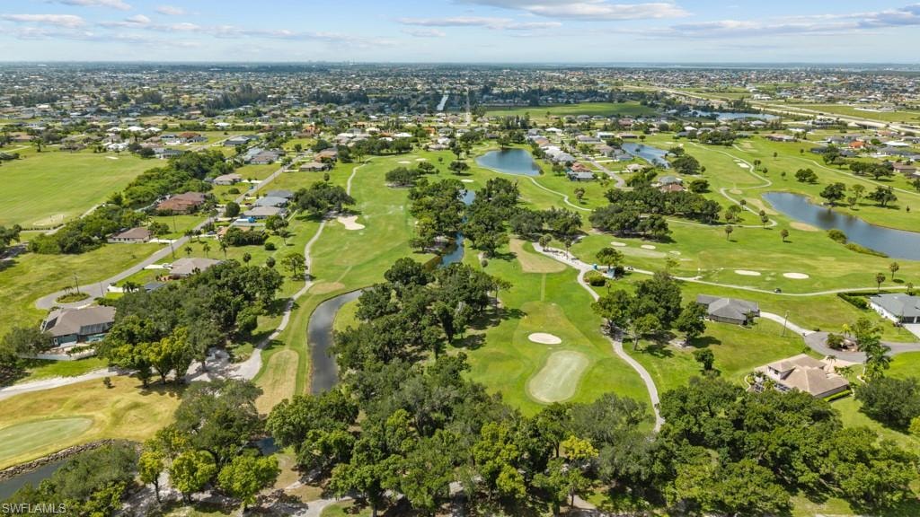 Expansive golf course community featuring manicured greens, mature trees, and multiple water features