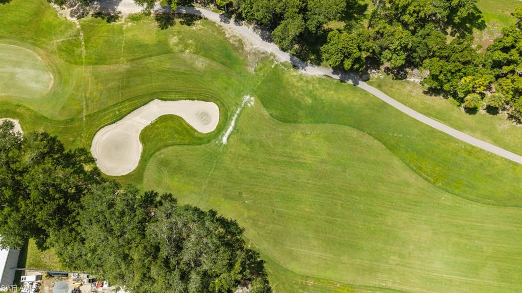 Expansive golf course terrain featuring manicured greens and sand traps