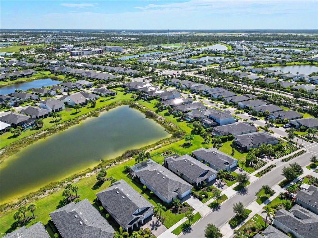Residential community featuring numerous single-family homes, multiple retention ponds, and established landscaping