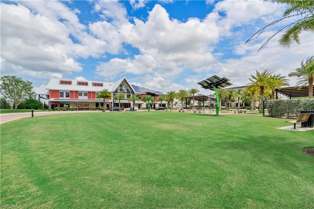 Expansive green space featuring a large lawn area