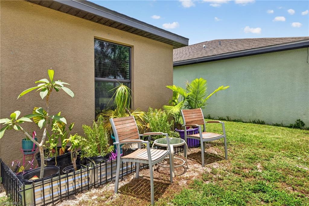 Exterior wall with textured stucco finish and a dark-framed window