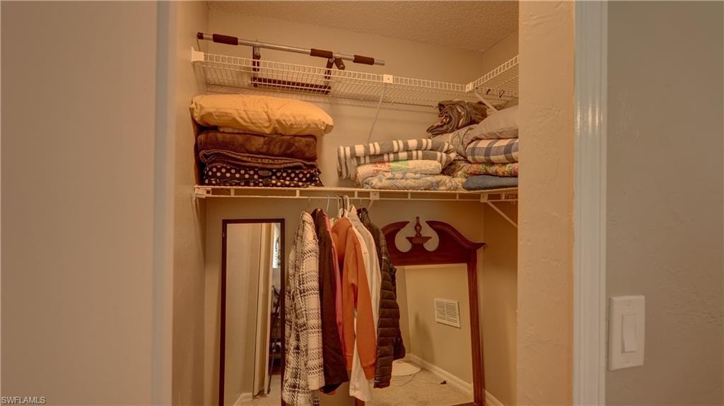 Interior closet featuring wire shelving system, clothing rod, and neutral wall paint