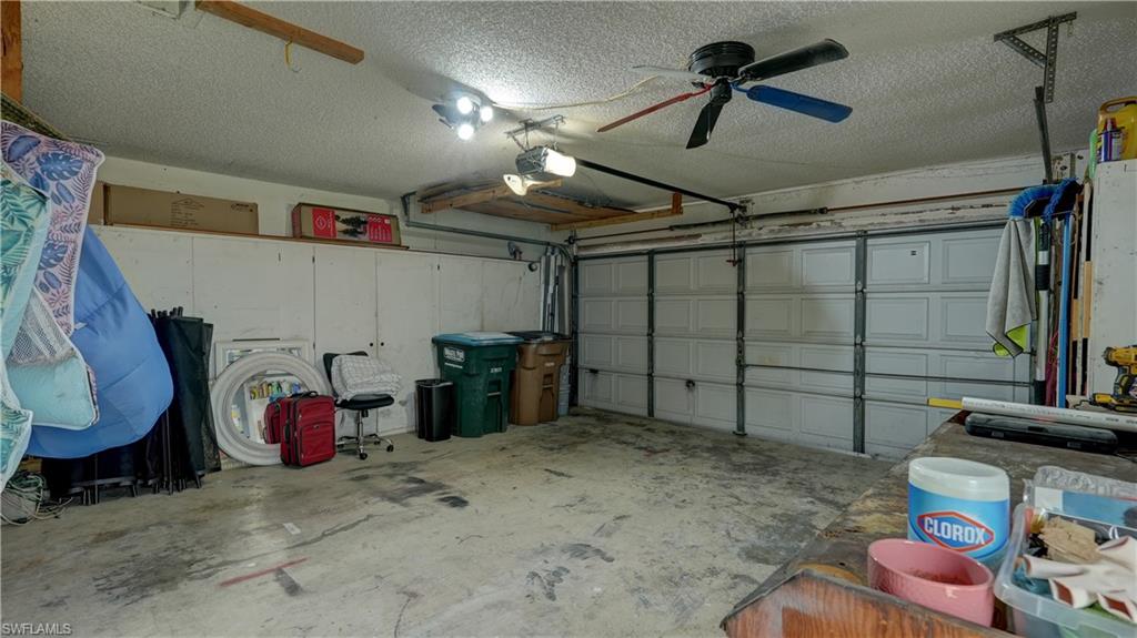 Garage interior featuring a sectional overhead door and built-in storage cabinetry