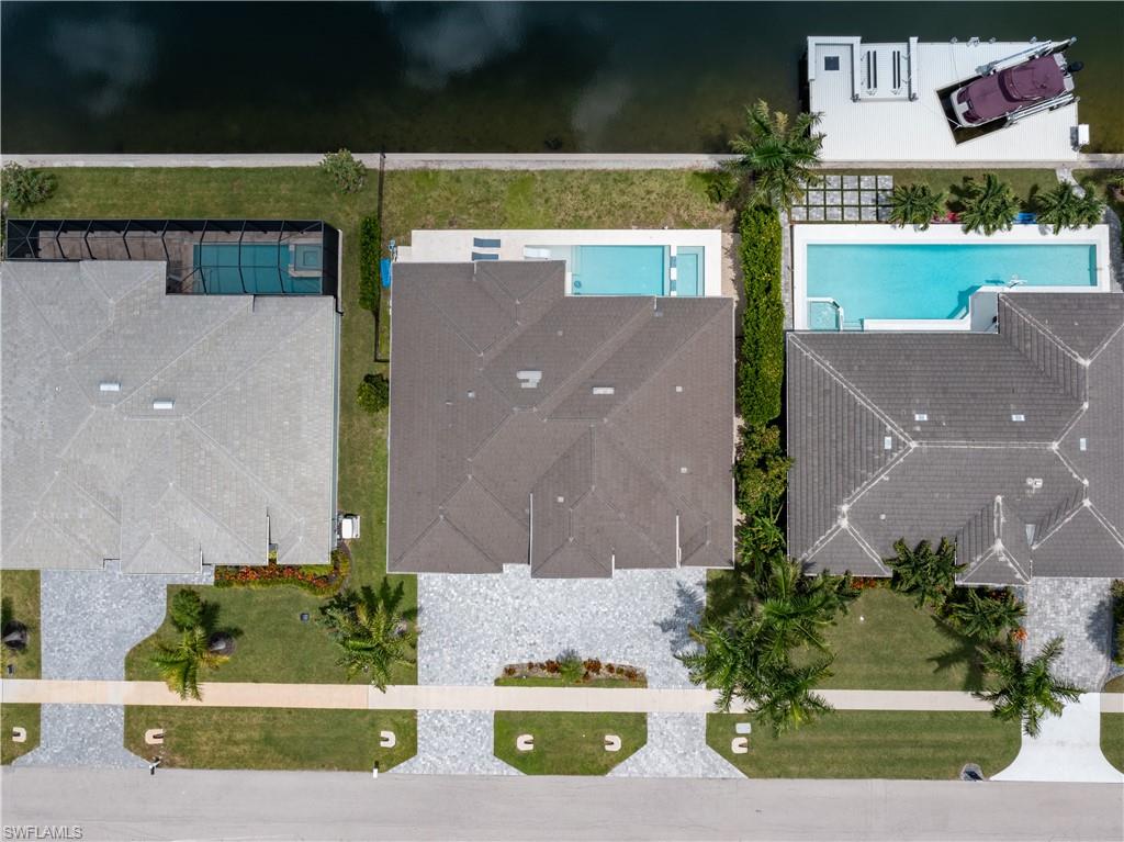 Aerial view showcasing three residences with resort-style amenities