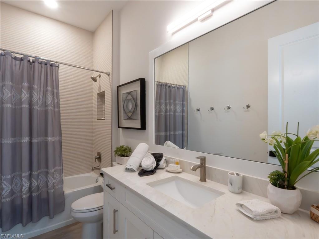 Spa-inspired bathroom featuring a floating vanity with quartz countertop, vessel sink, and polished chrome fixtures