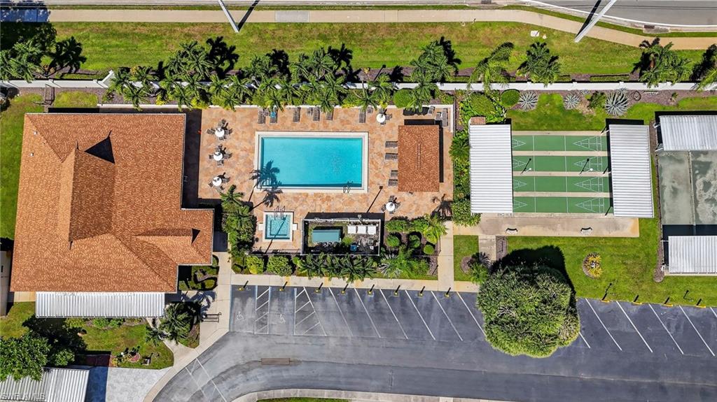 Community amenities featuring a swimming pool, spa, shuffleboard courts, and a tennis court