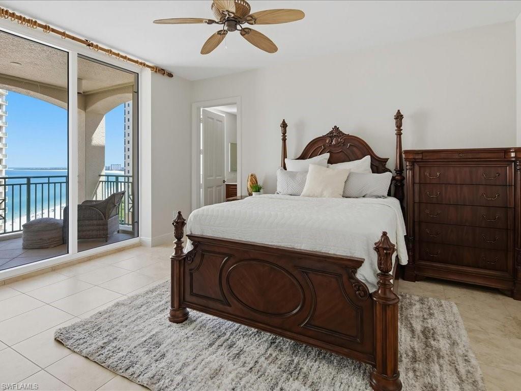 Spacious room featuring floor-to-ceiling sliding glass doors opening to a private balcony