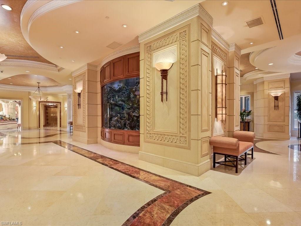 Community lobby featuring ornamental molding and recessed lighting