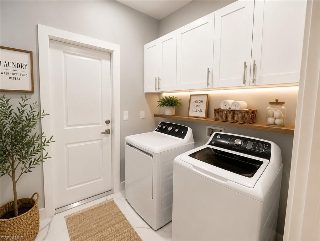 Dedicated laundry space featuring white shaker cabinetry, under-cabinet lighting, a floating wood-finish shelf, and white paneled door