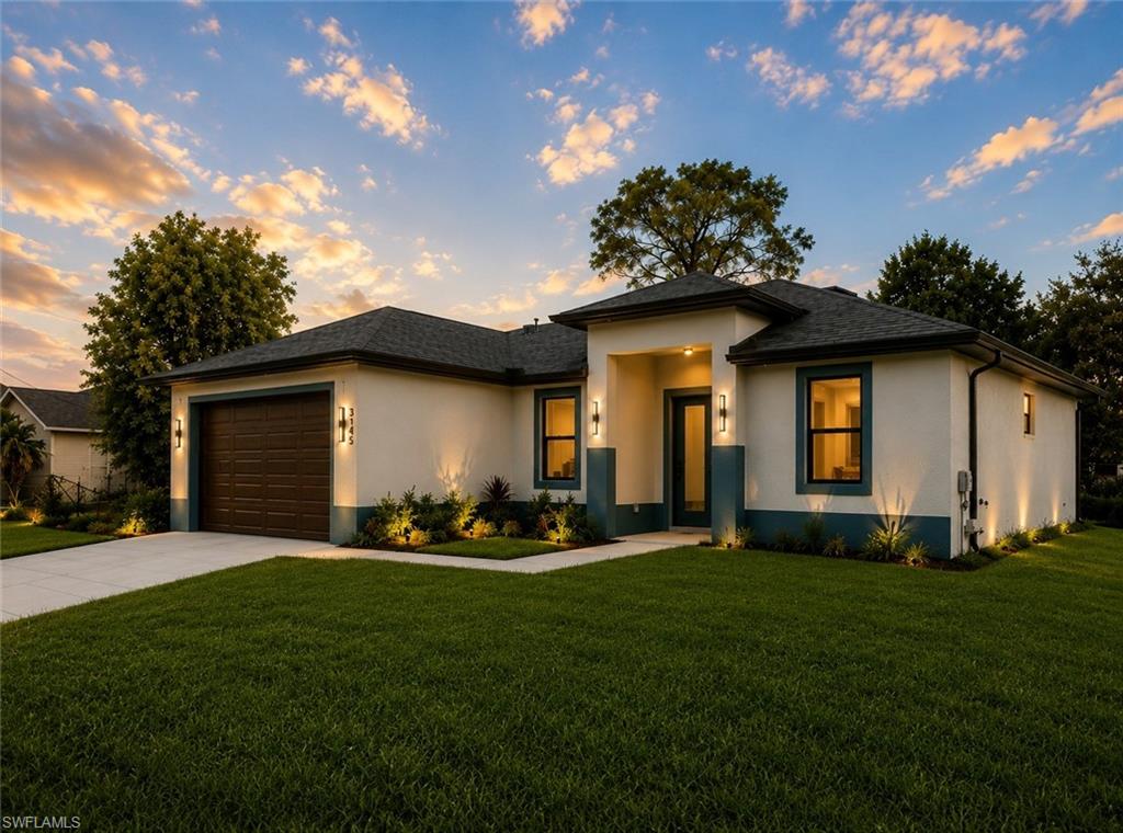 Contemporary single-story residence featuring a two-tone exterior, a dark-paneled garage door, and a covered entry