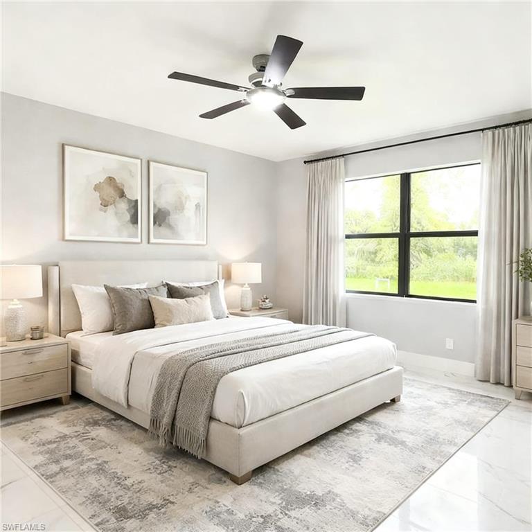 Spacious bedroom with a large window, a ceiling fan, light-toned walls, and tile flooring partially covered by an area rug