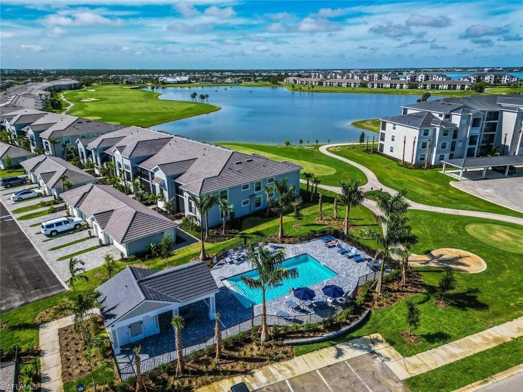 Aerial perspective of suburban area featuring a large body of water