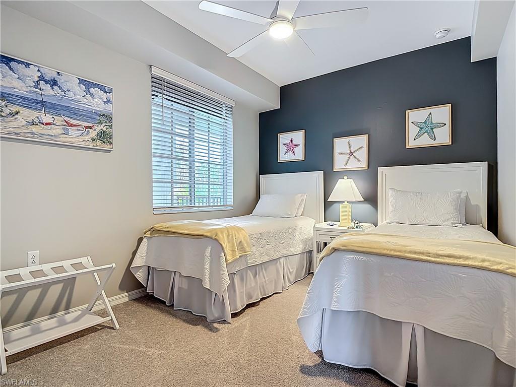 Bedroom featuring carpet and ceiling fan