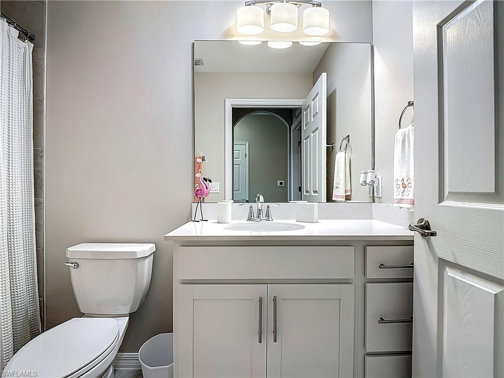 Bathroom featuring vanity and a shower with shower curtain