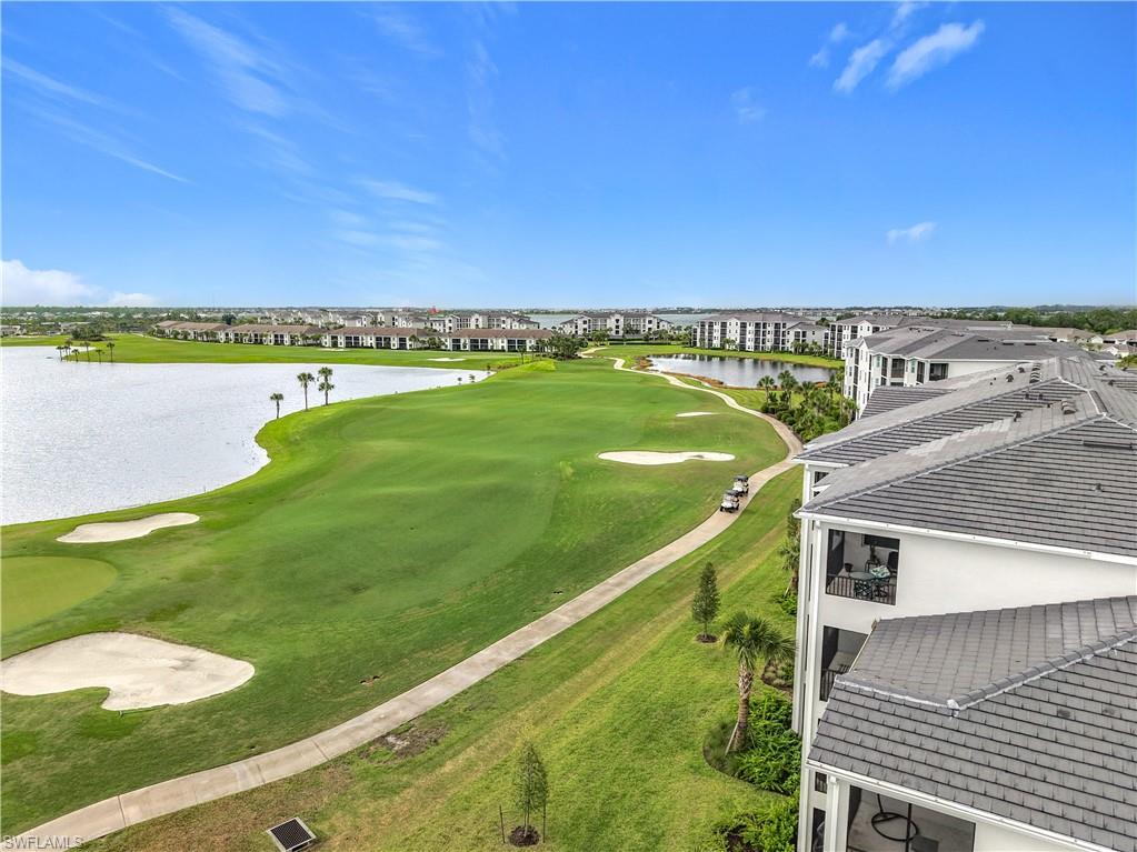 Aerial view of a local golf course and a nearby body of water