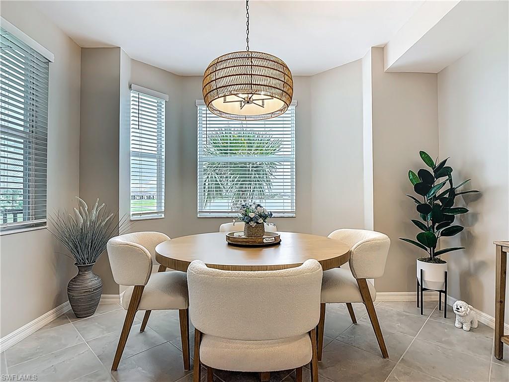 Dining area featuring light tile patterned floors