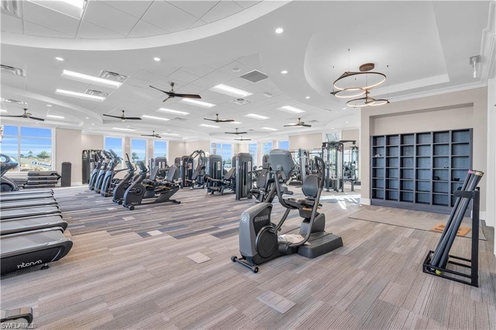 Gym featuring light carpet, plenty of natural light, and recessed lighting