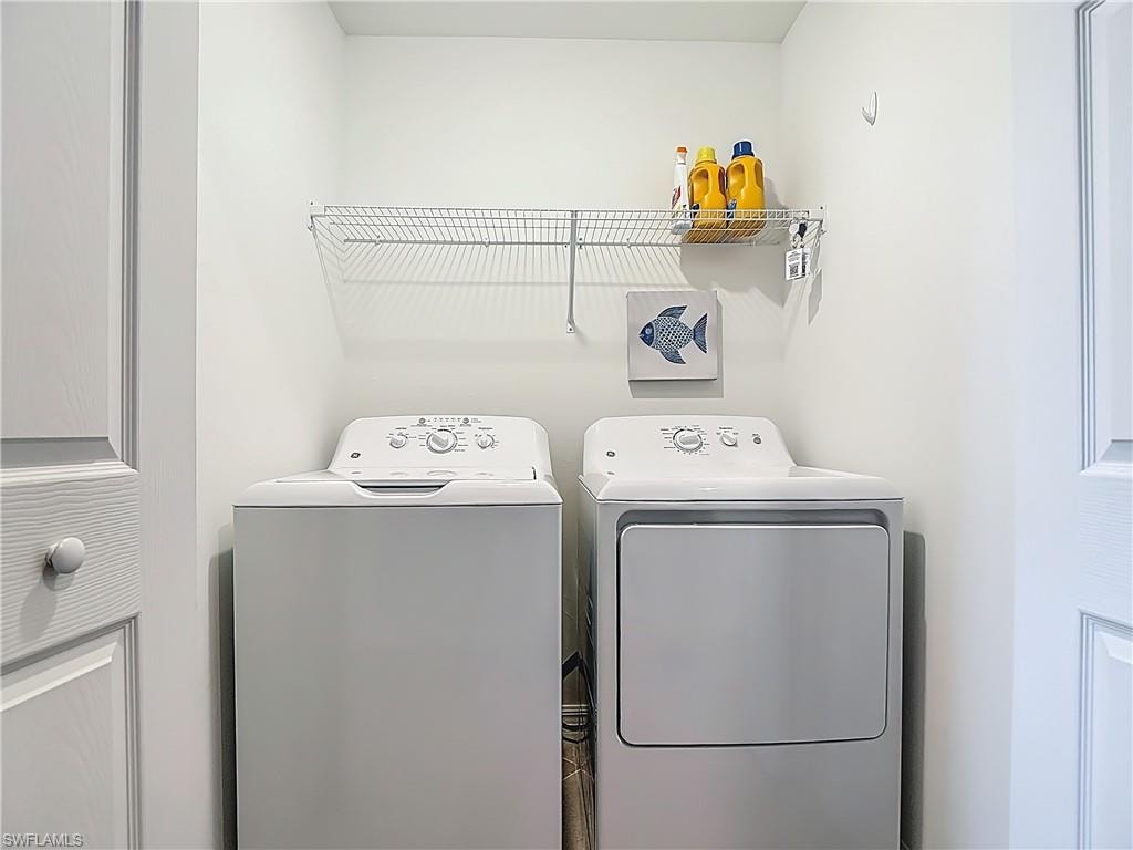Laundry area featuring separate washer and dryer