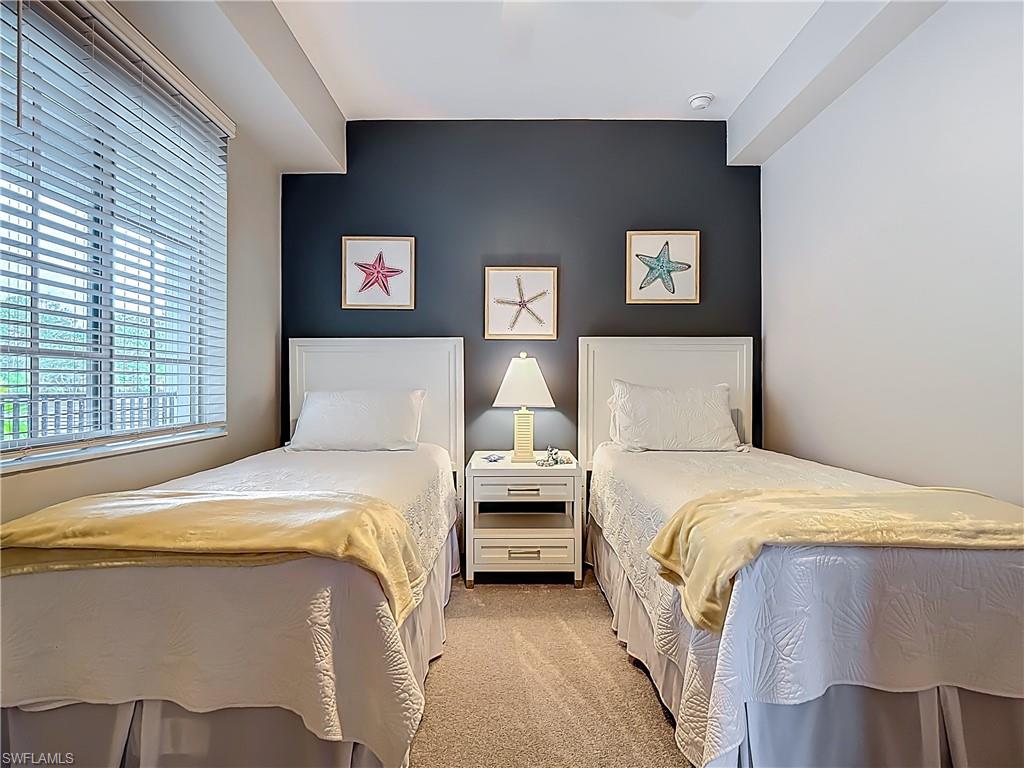 Bedroom with light colored carpet