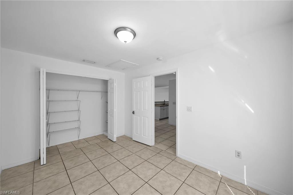 Neutral-toned tile flooring throughout